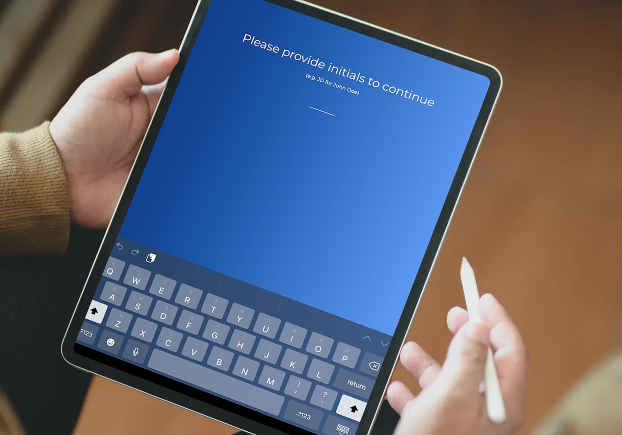 man being prompted to enter initials on iPad to access his secure consents